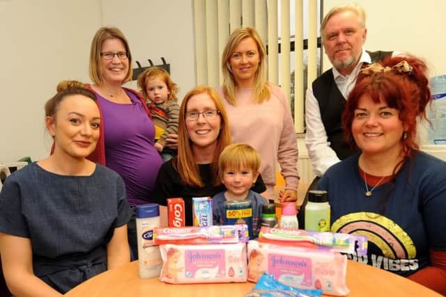 Kirkcaldy - Fife -  campaign about unused toiletries for Christmas - Carolanne Brown, Louise humpington with Isaac & Quinn,   Cara Forrester, Susan Simpson, Allan Crow & Claire Nicholson (Pic: Fife Photo Agency)