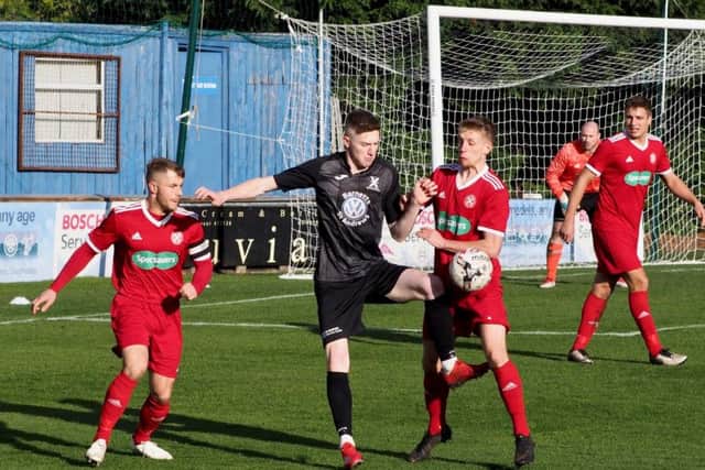 Action from Saturday's 8-1 defeat to St Andrews United.