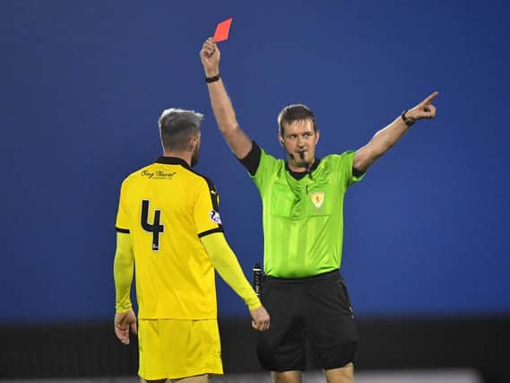 Iain Davidson receives his marching orders from referee Gavin Ross. Pic: Duncan Brown