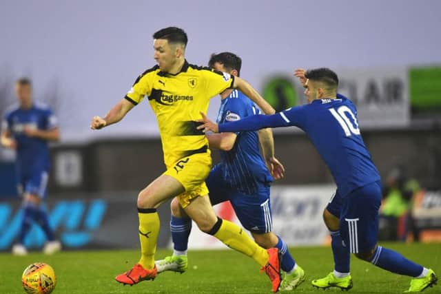 Raith's Michael Miller gets away from Jack Leitch