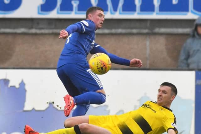 Raith's Michael Miller tackles Gary Fraser