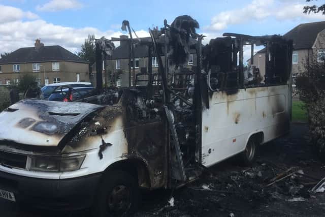 The bus destroyed by fire.
