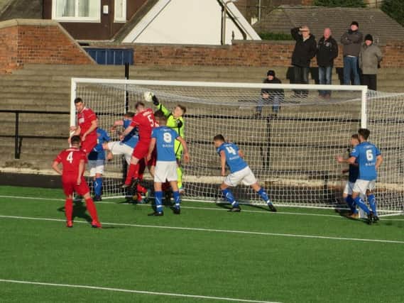 A crowded Bo'ness box as YM attack from a corner.