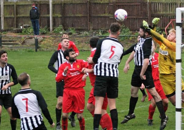 Newburgh are forced the pull plenty of bodies back onto the line. Pic by Graham Strachan.