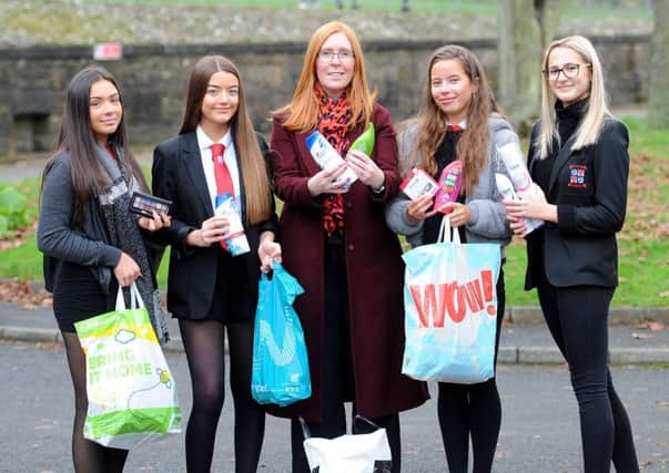 Cara Forrester (centre) receives donations from pupils Emma Struthers, Milly Macgregor, Camryn Smart & Alex Briggs.  Pic: Fife Photo Agency