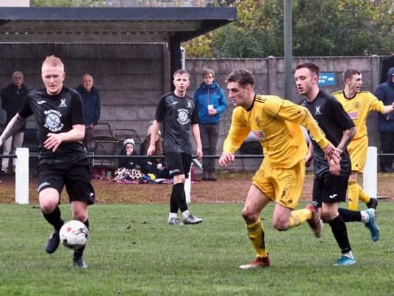 Action from Burntisland Shipyard's defeat to St Andrews United on Saturday. Pic: Blair Smith