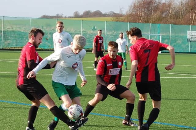 Ricki Cooper is surrounded by Rosyth players. (Pic by John Laing)